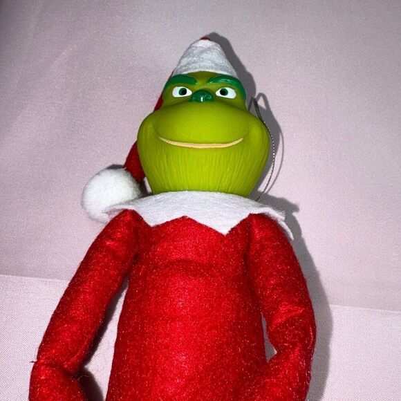 Red Grinch on a shelf - Picture 2 of 3